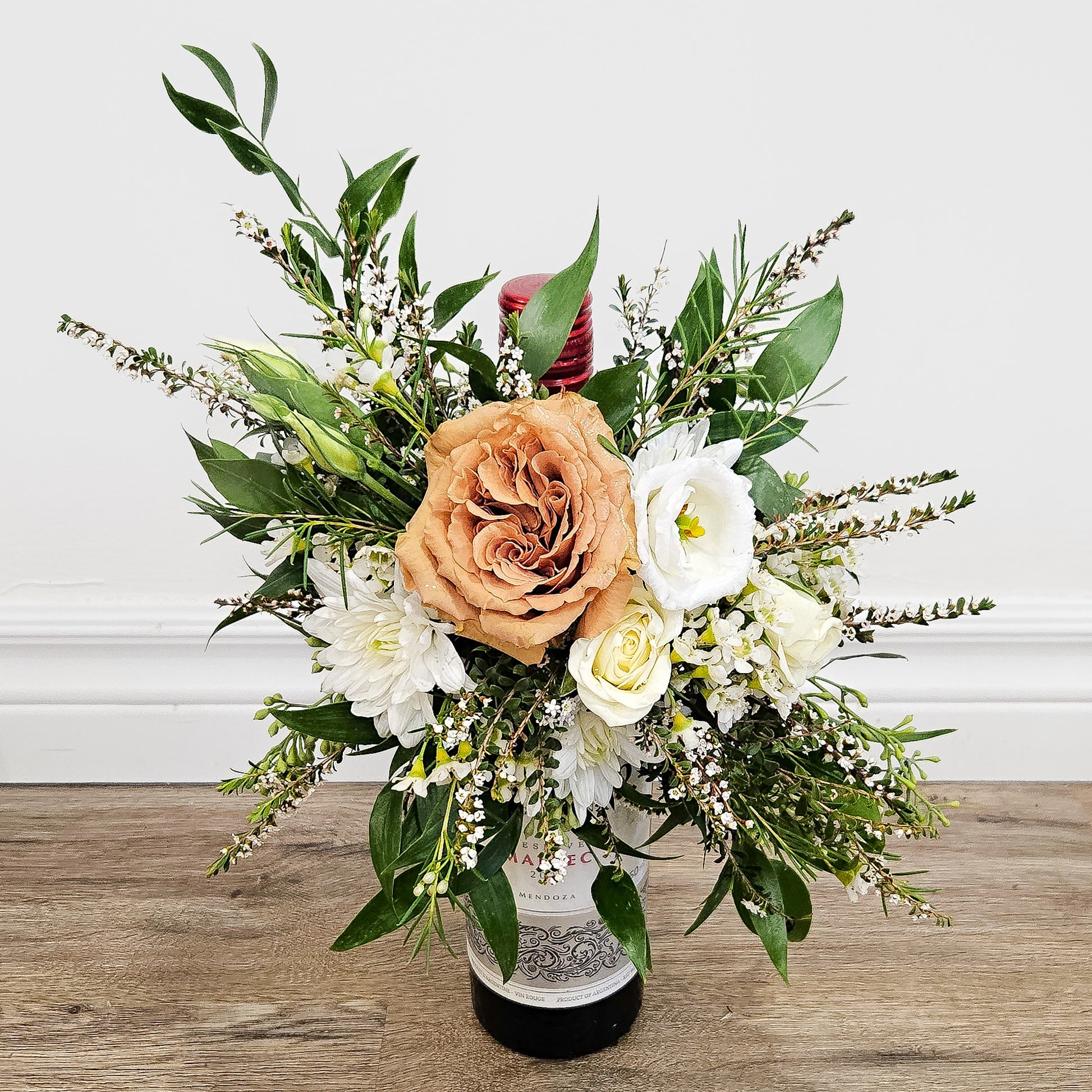Wine bottle flower arranngement
