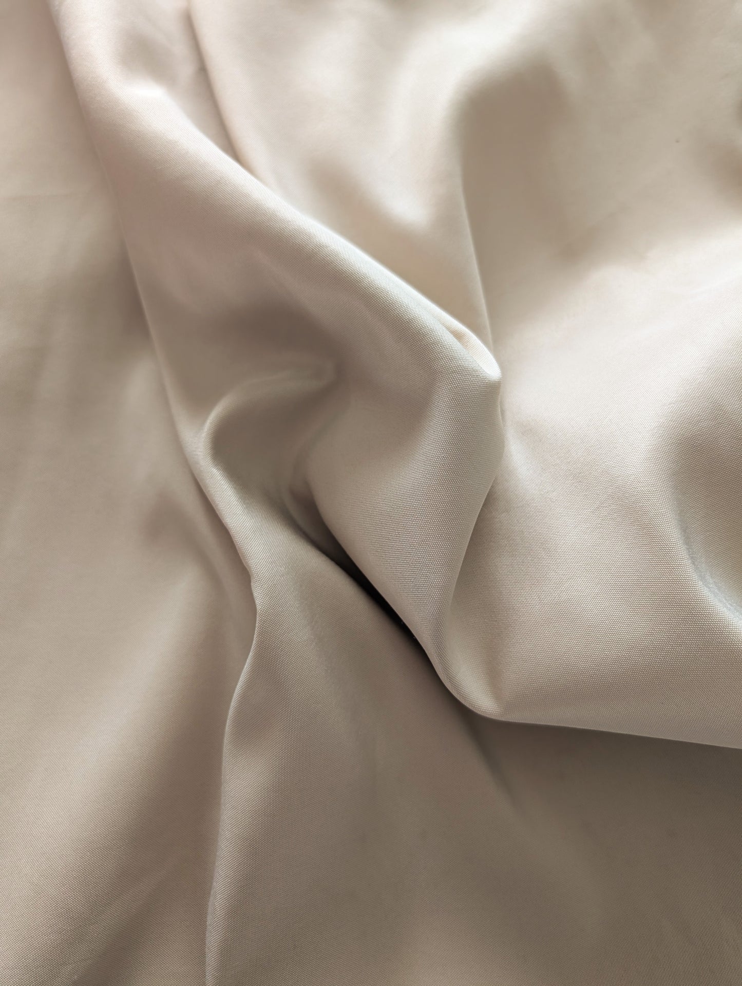 Close up of beige tablecloth