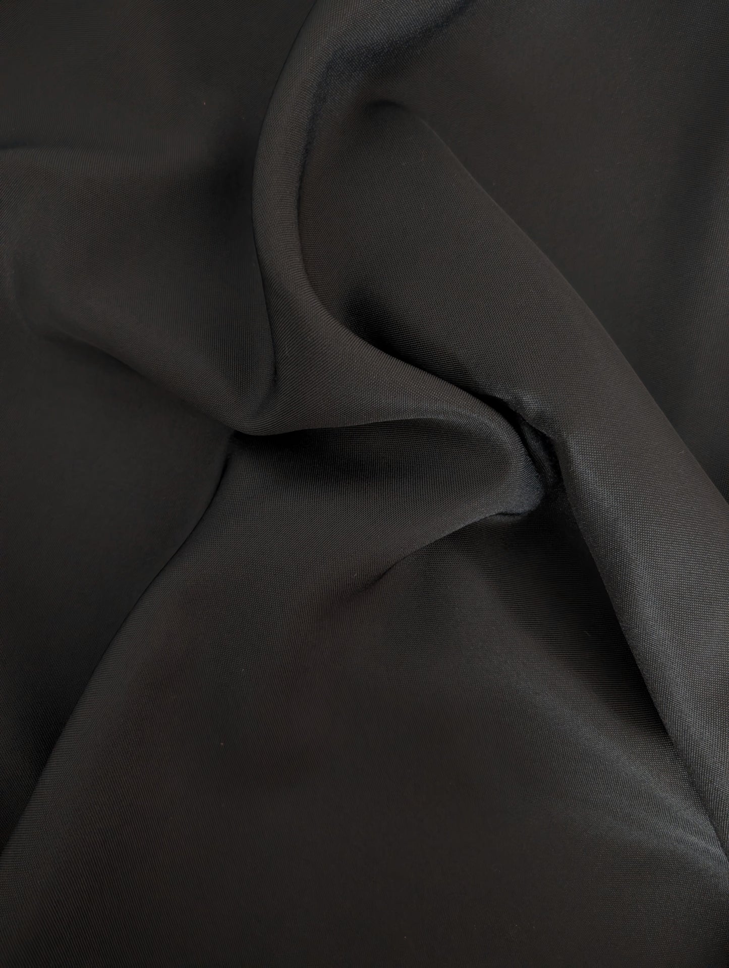 Close-up of dark fabric with folds
