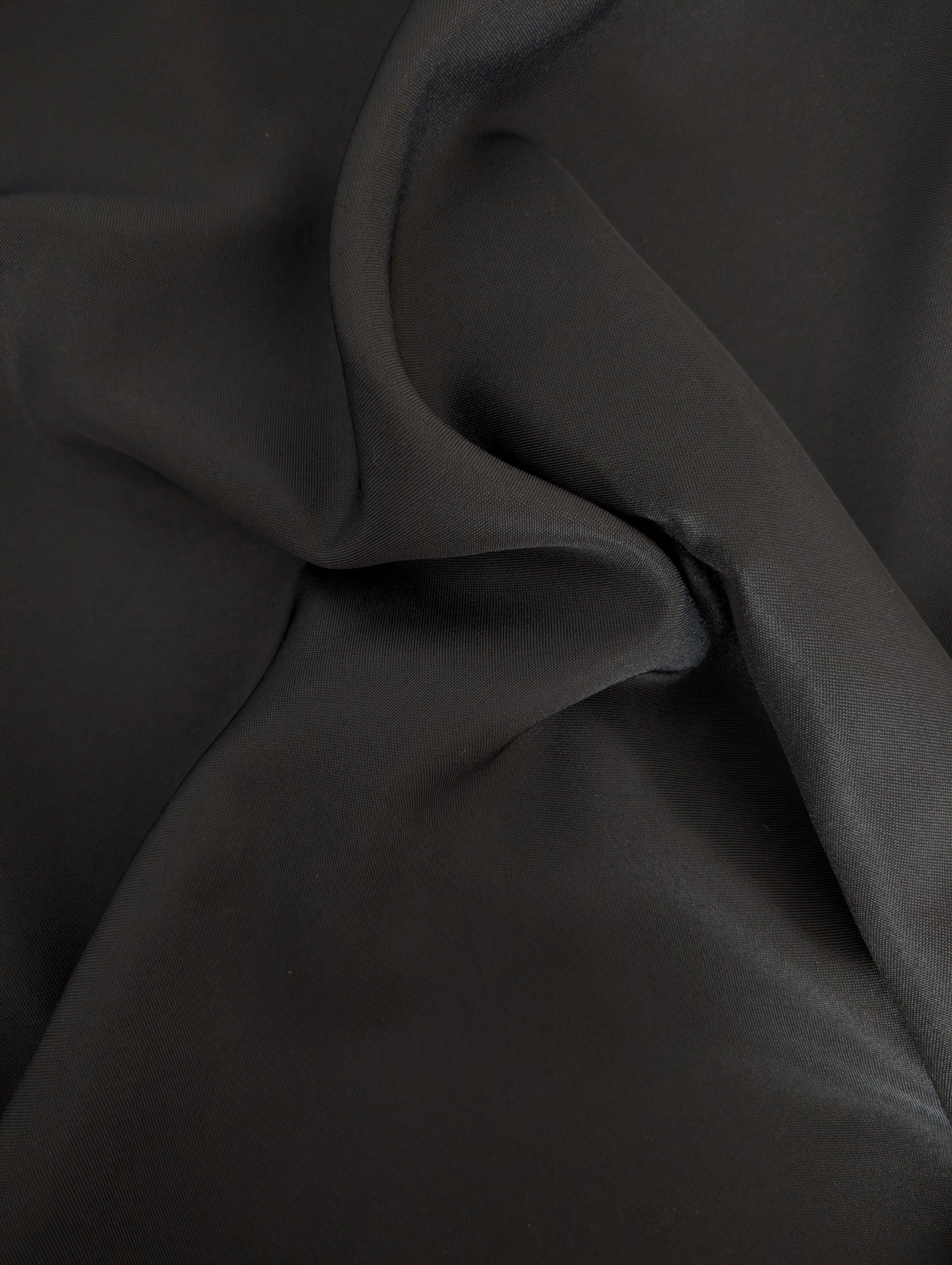 Close-up of dark fabric with folds