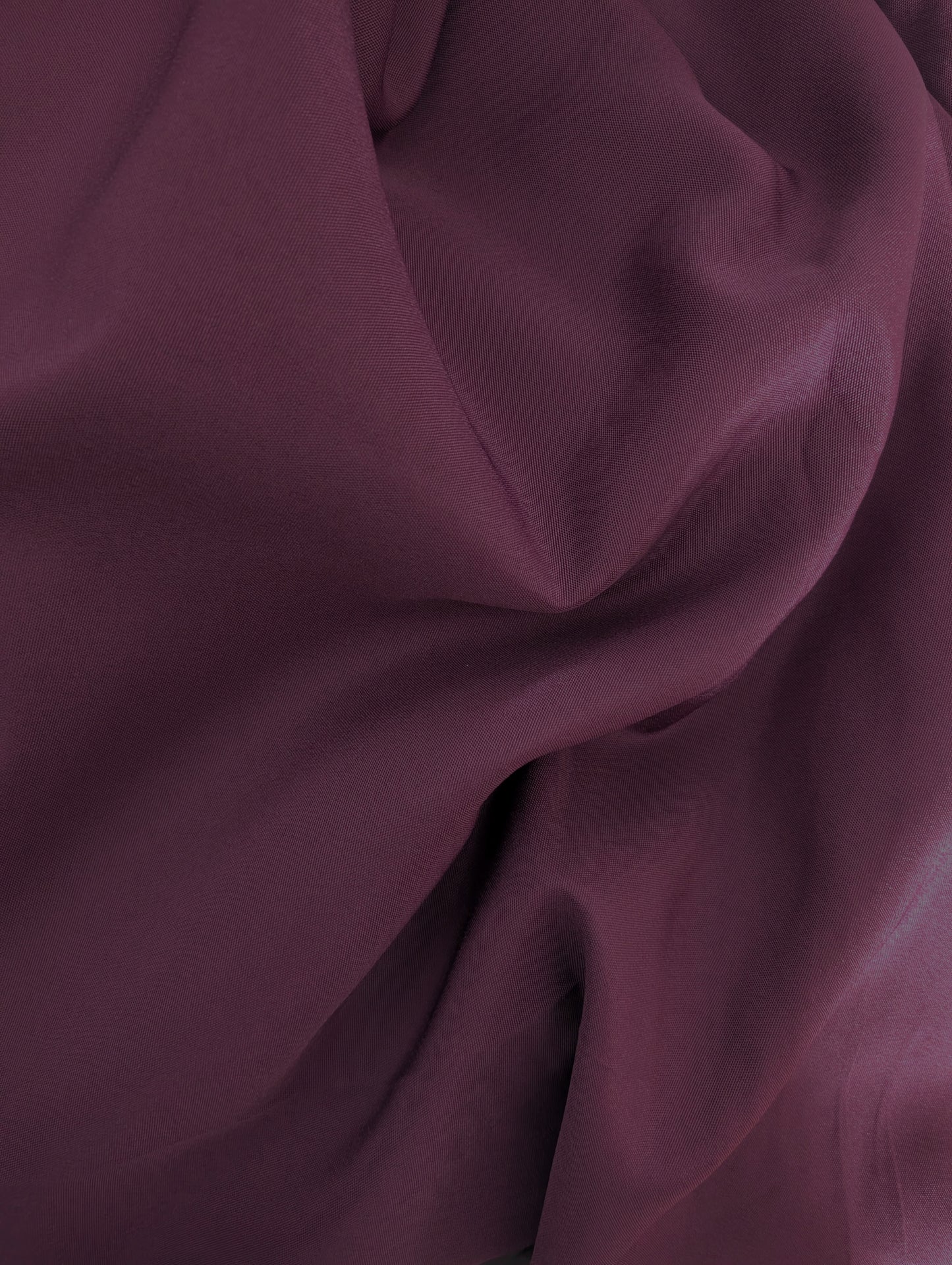 Close-up of dark purple fabric with folds