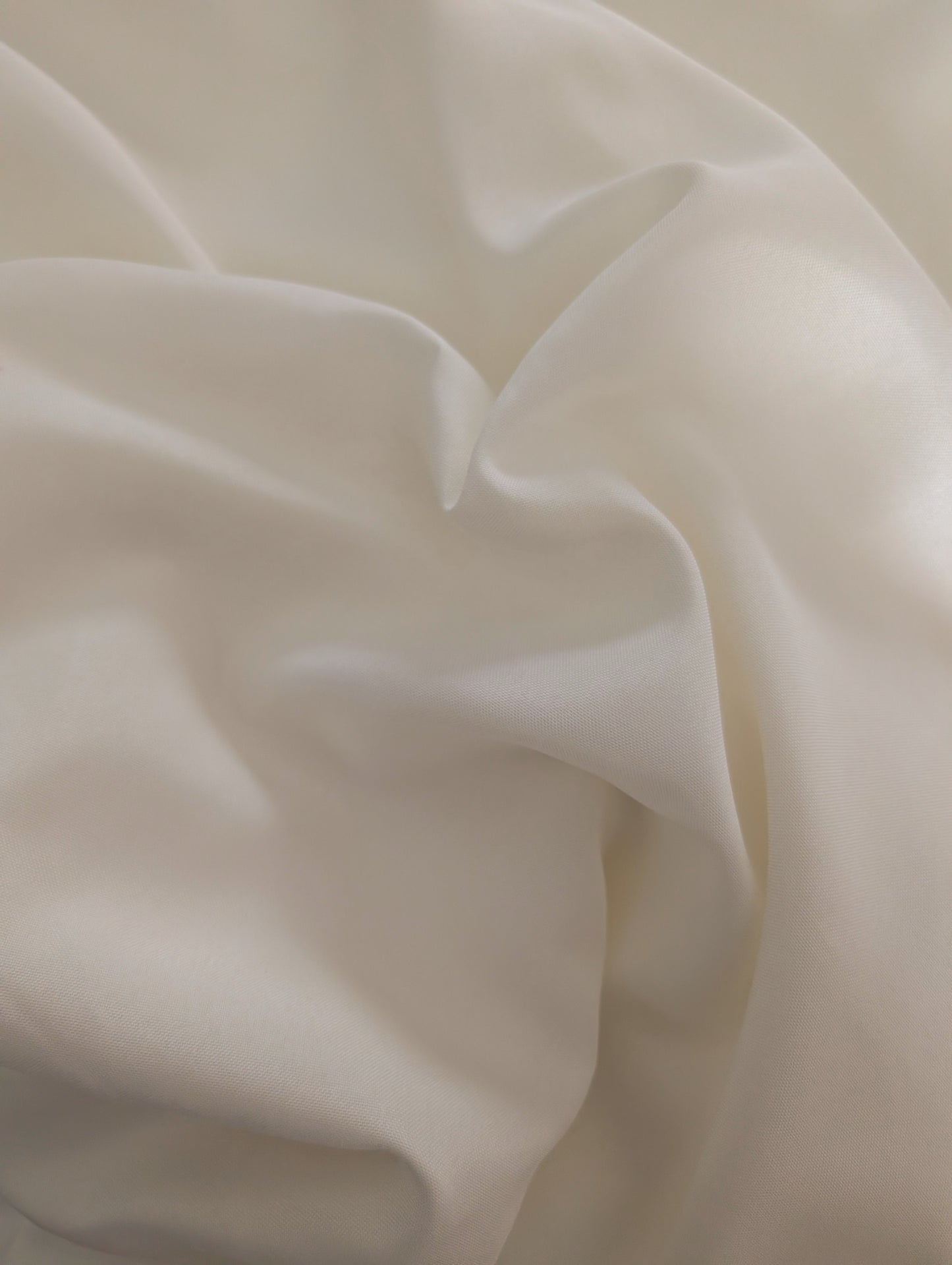 Close-up of beige fabric with folds