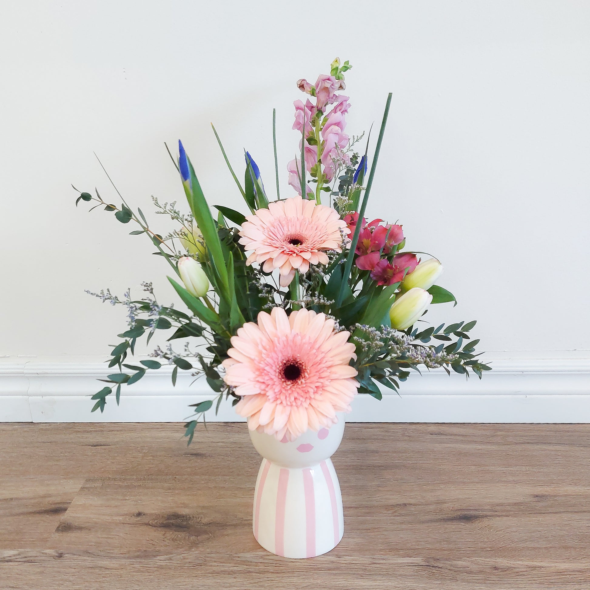 mixed flowers in lady vase
