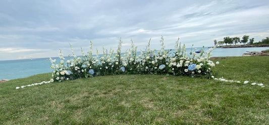 Blue hydrangea white roses grounded ceremony arch for ourdoor wedding